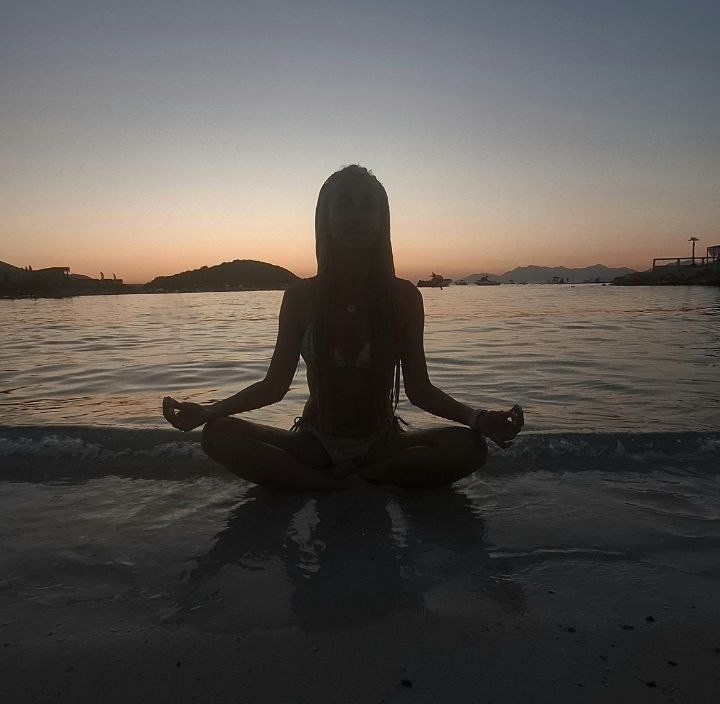 Meditation on the seashore at sunset